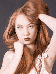 Young woman showcasing her beautiful hair.