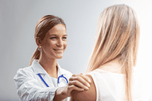 A woman talking to a medical professional.