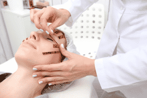 A woman being prepped for a liquid facelift