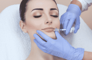 A woman being injected with Botox.